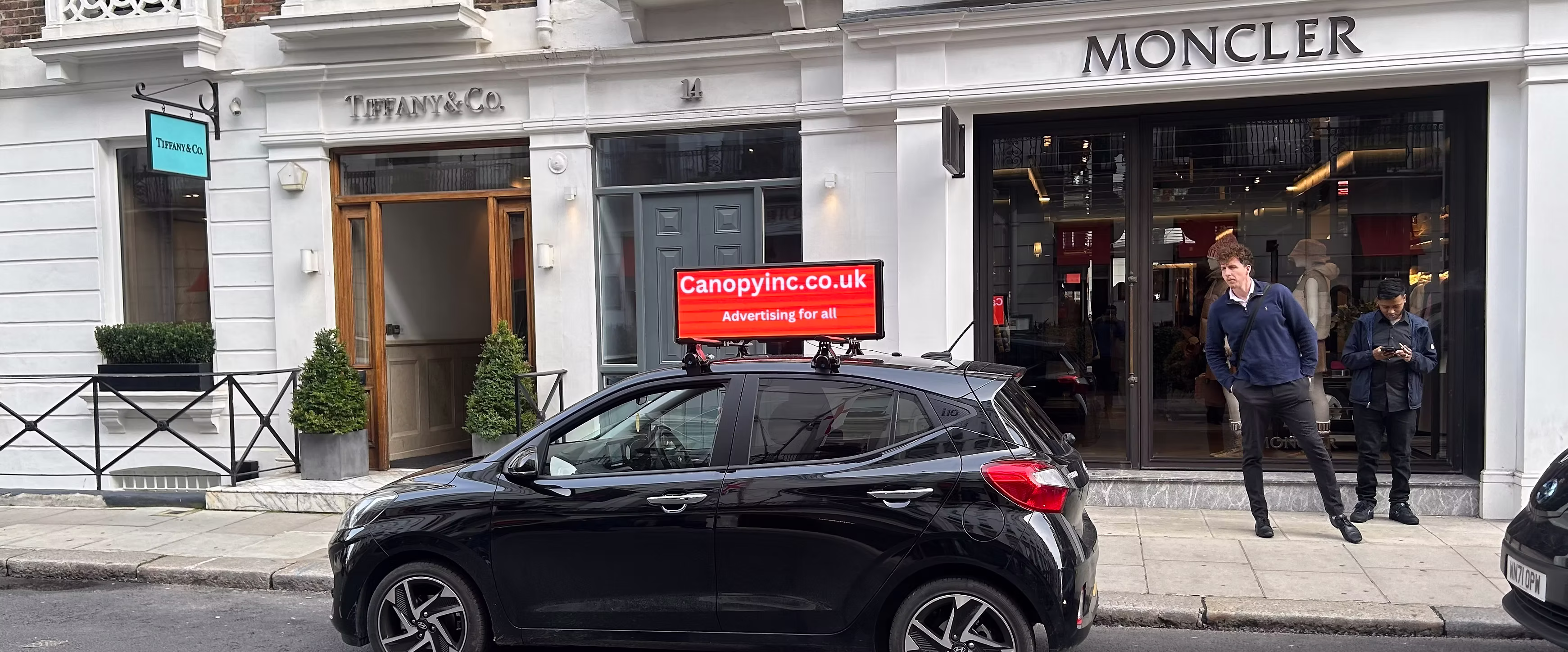 Canopy digital screen advertising in urban environment